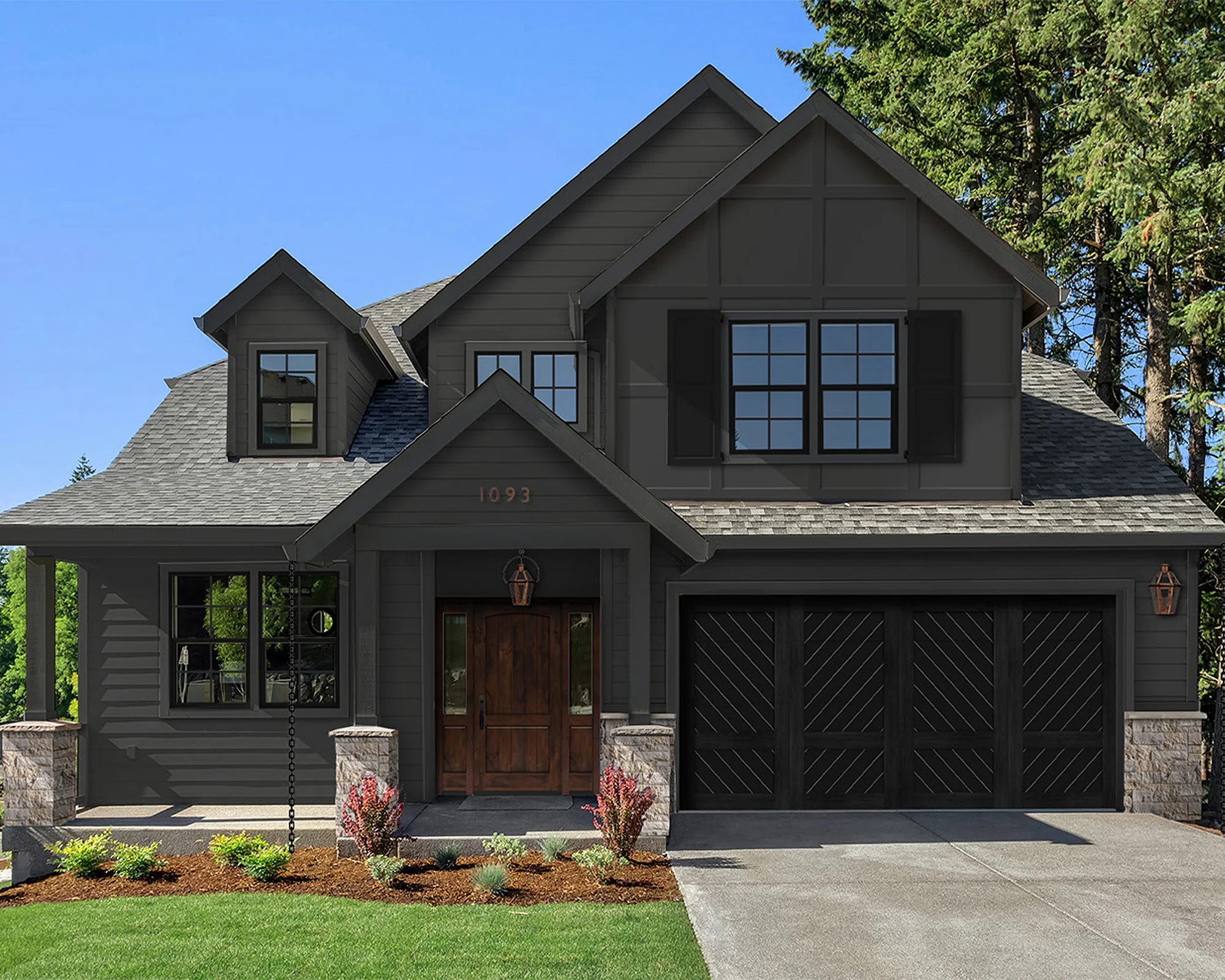 Dark Modern Cottage Exterior Design with charcoal paint, natural stone and copper accents