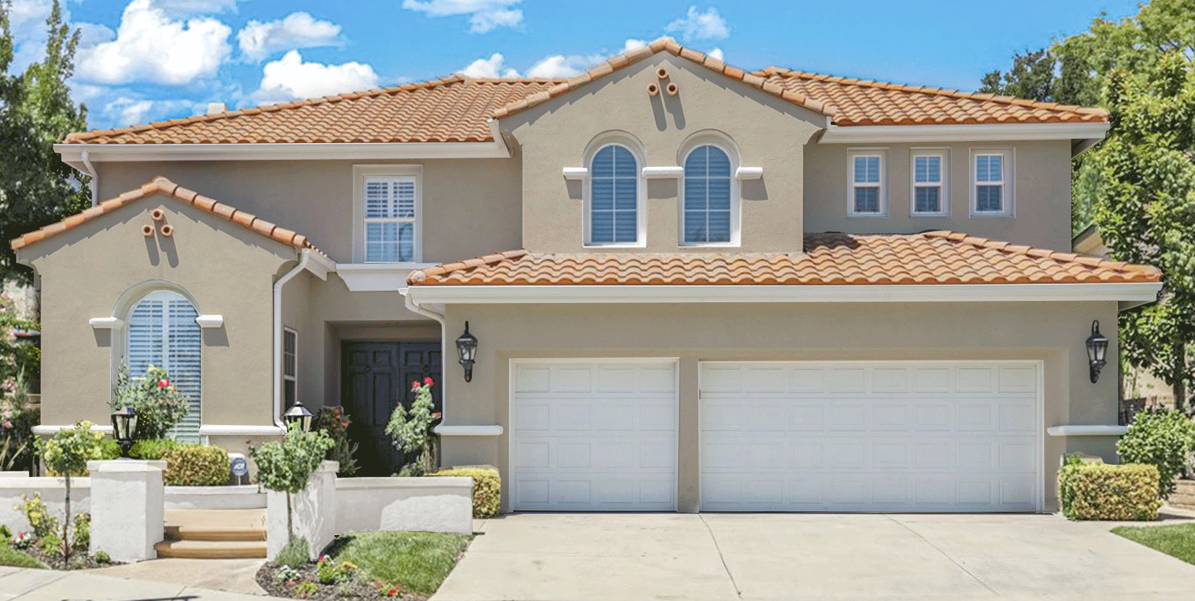 a before and after give of a Spanish style home that has the siding painted to match the trim to feel more modern