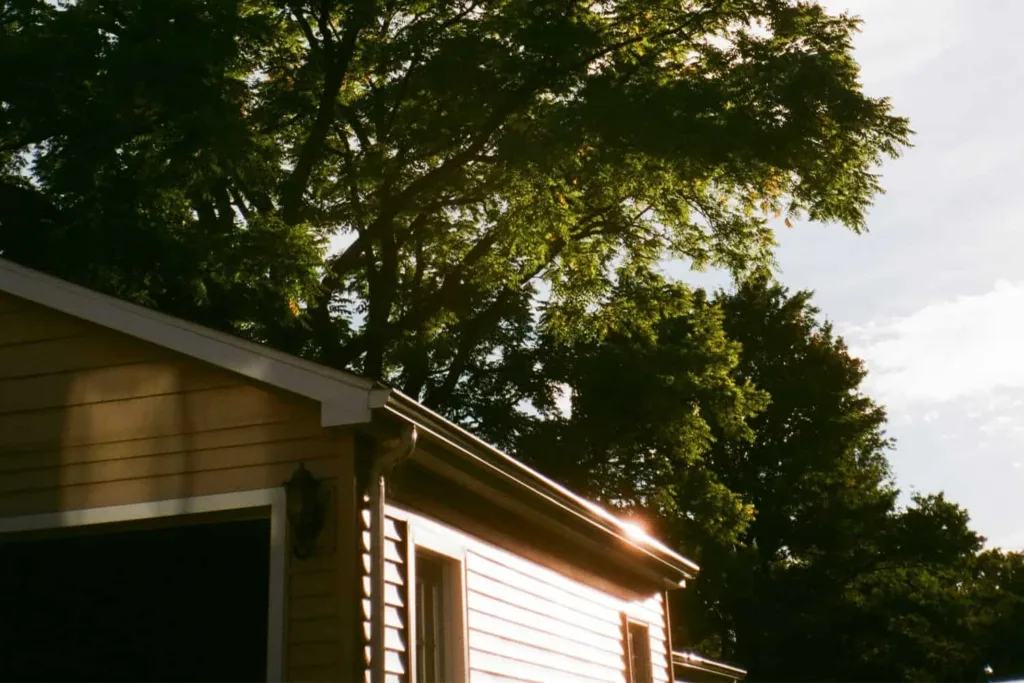 the side of a garage with sun shining directly on it